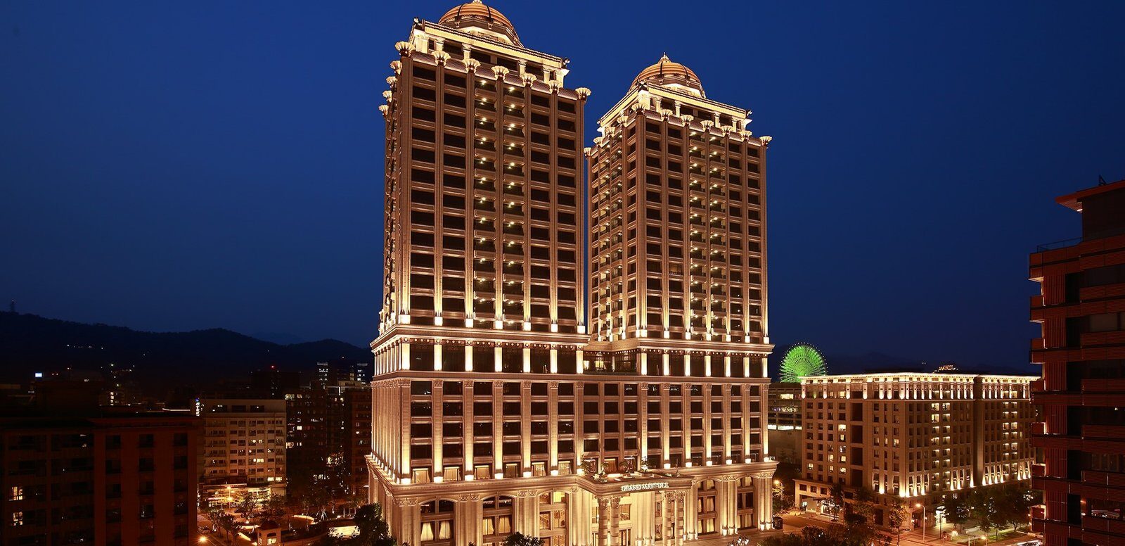 The twin towers of Grand Mayfull Hotel Taipei at night