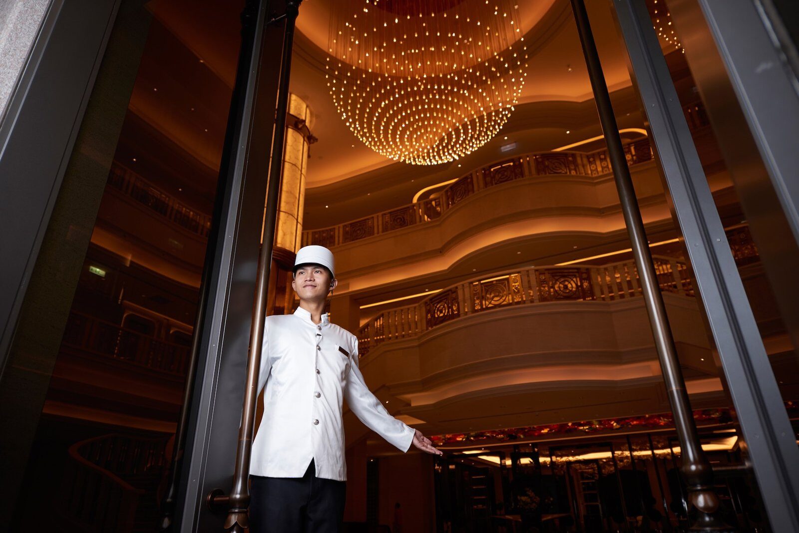 A doorman at the lobby entrance of Grand Mayfull Hotel Taipei