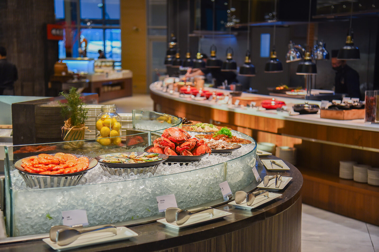 The seafood ice counter at the Market Café buffet, with the hot food section behind