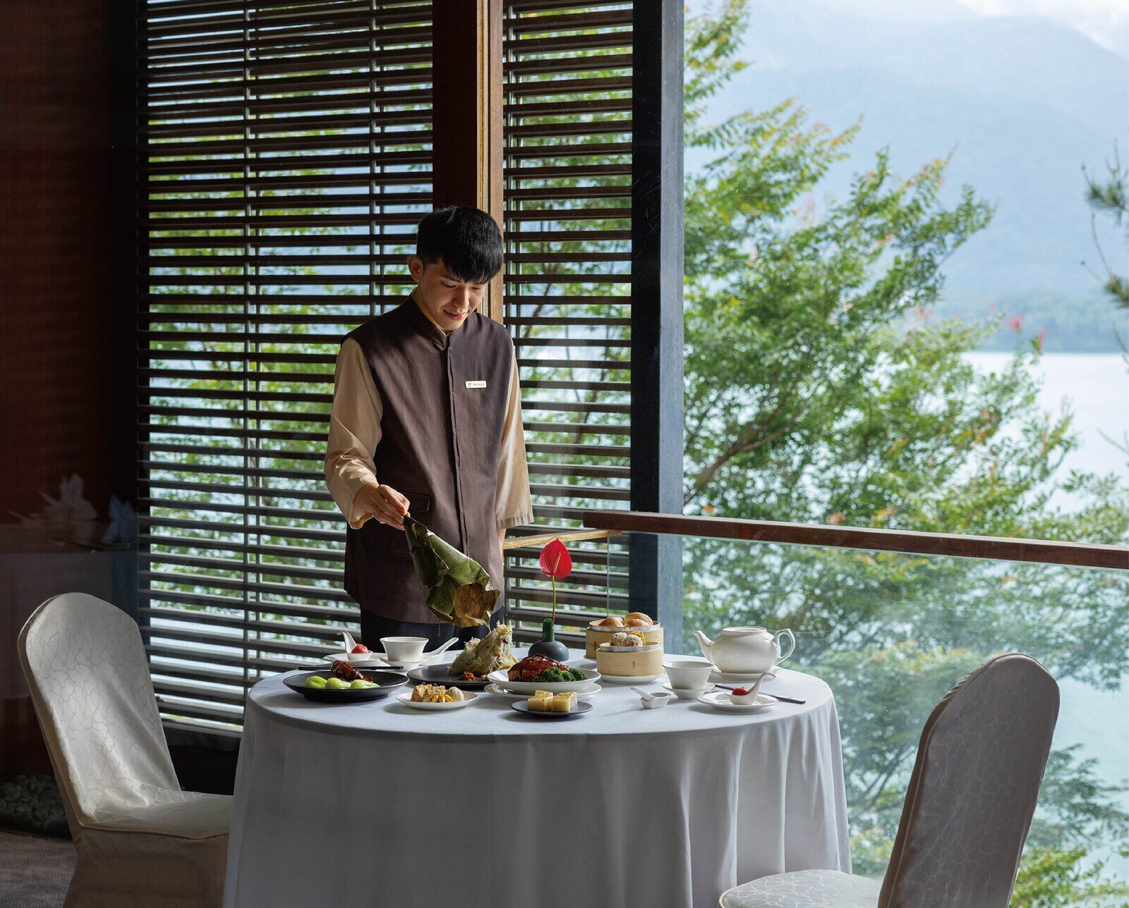 The dining room and floor-to-ceiling windows of The Lake View Chinese Restaurant at The Lalu, Sun Moon Lake
