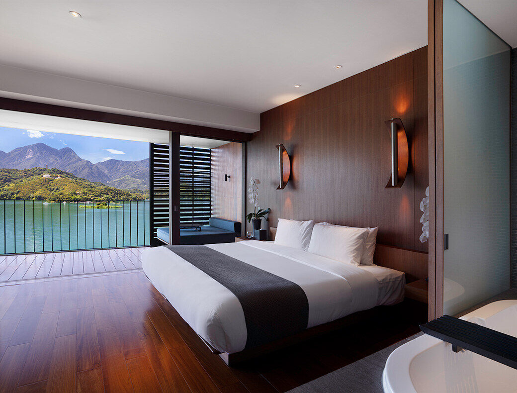 A bedroom with floor-to-ceiling windows at The Lalu, Sun Moon Lake